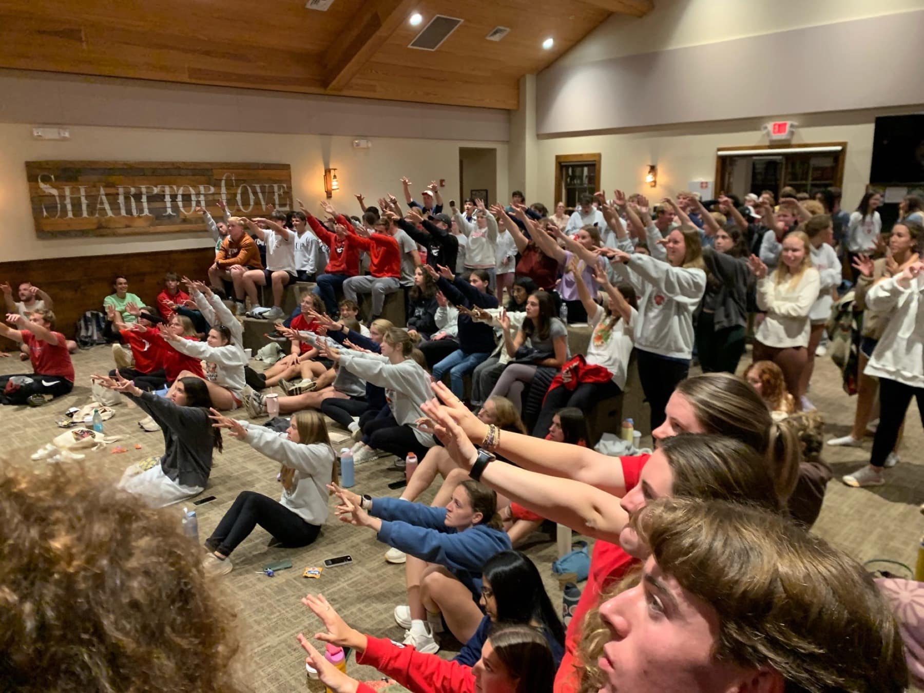 A large group of RUF students gathered indoors at Fall Conference