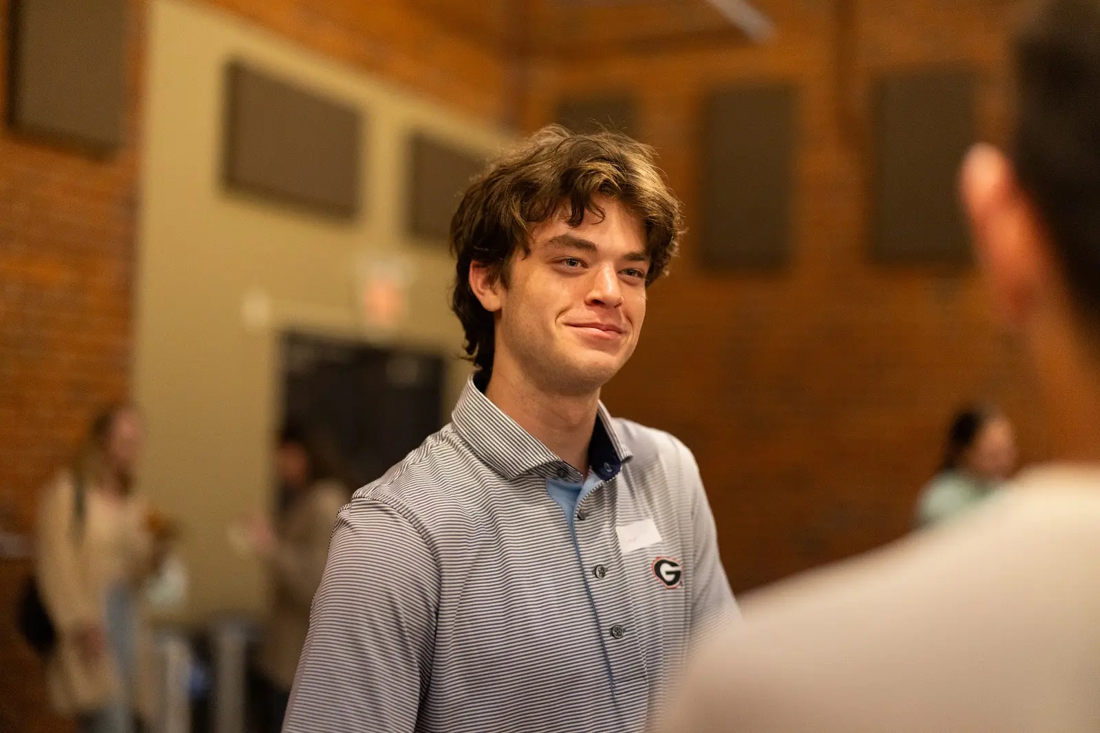 A student listening during a conversation after Large Group
