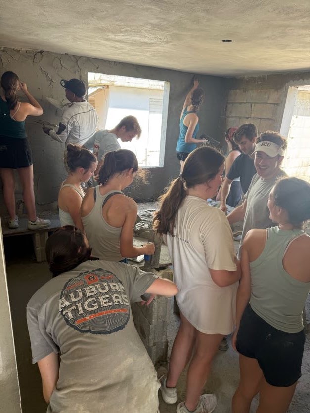 Students working closely together inside the project site