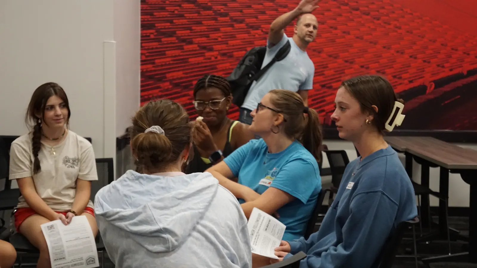 First-year students talking together around a table
