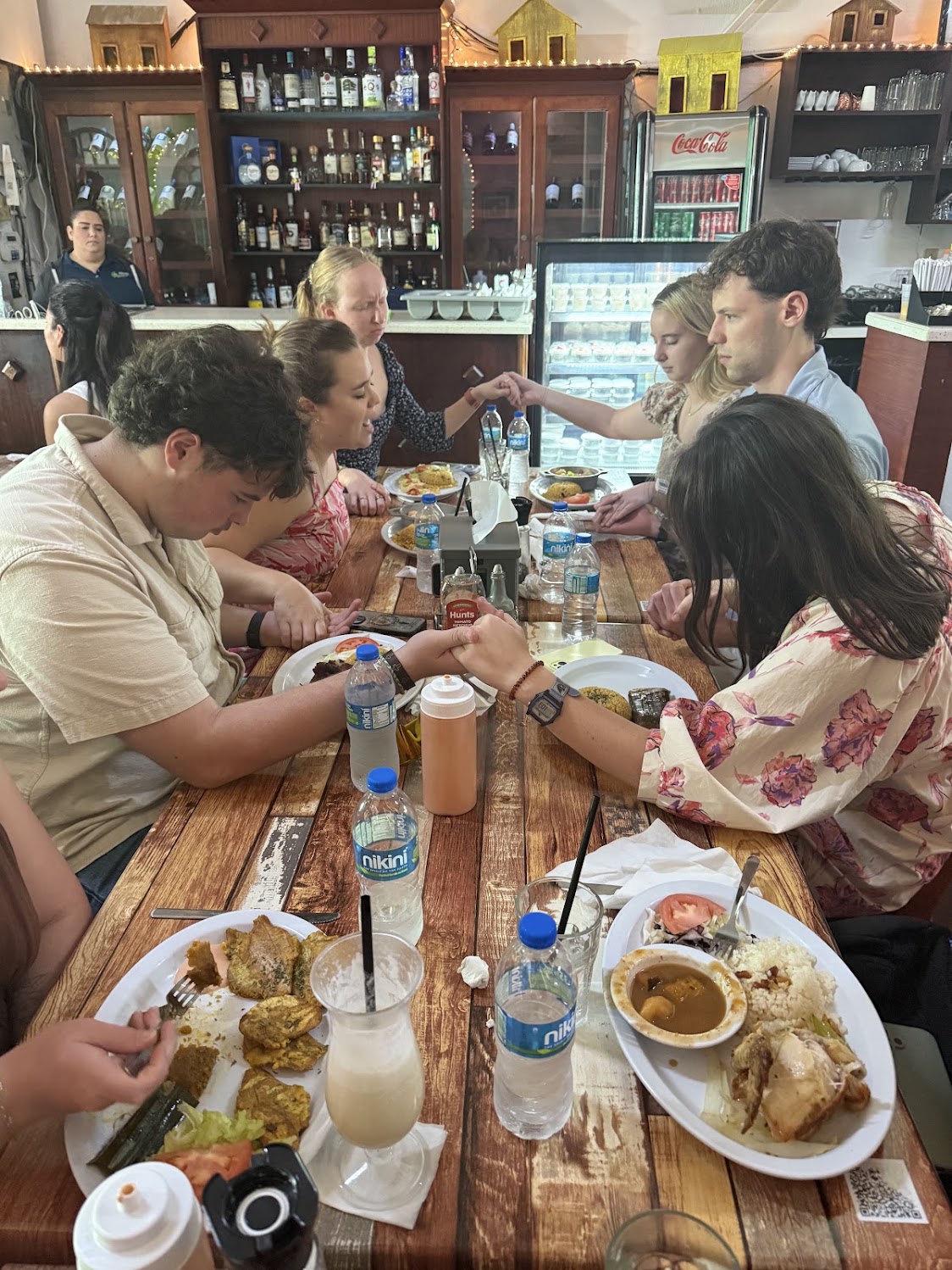 The mission team sharing a long meal together