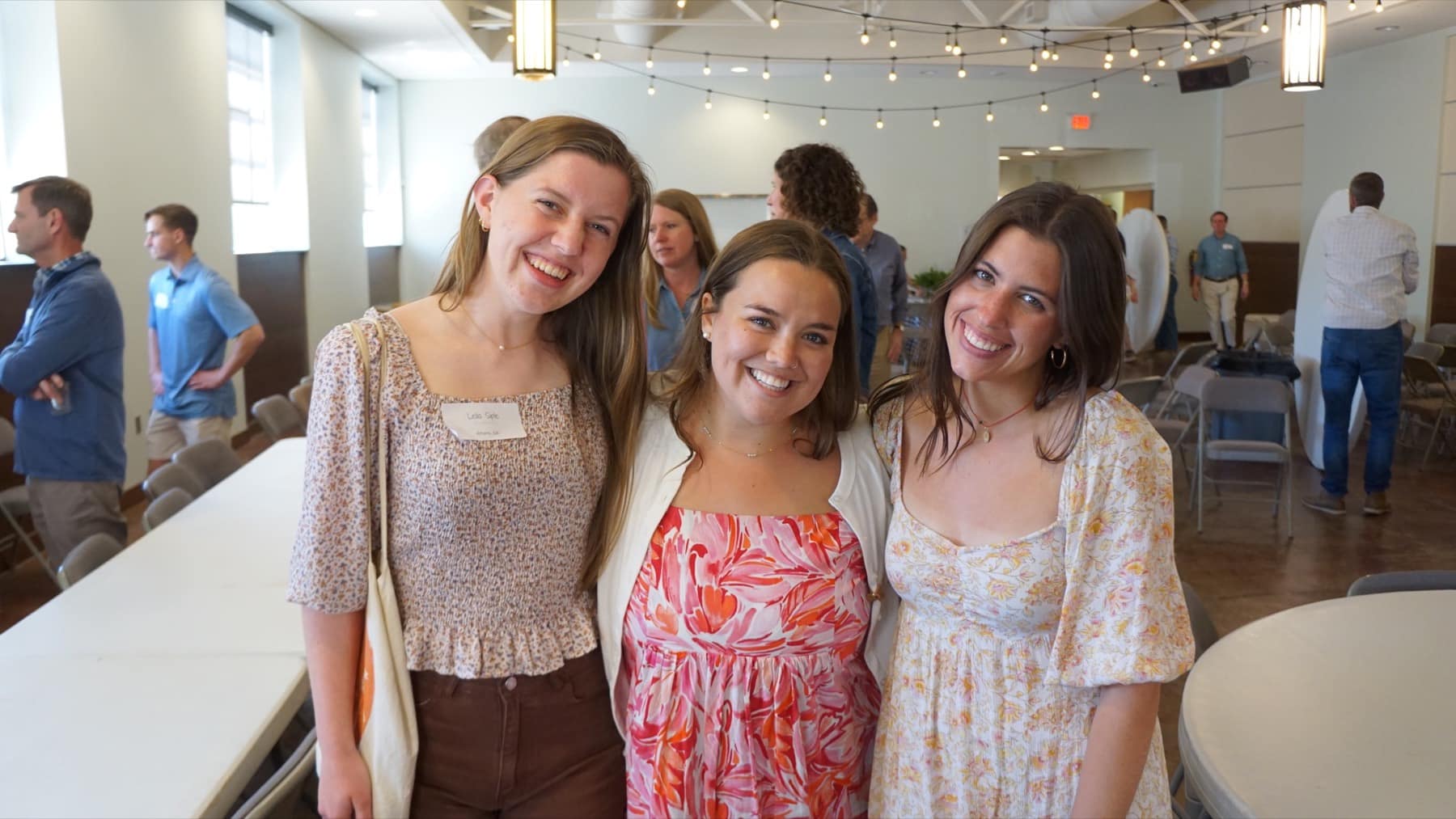 Three students smiling together at RUF Parents Lunch