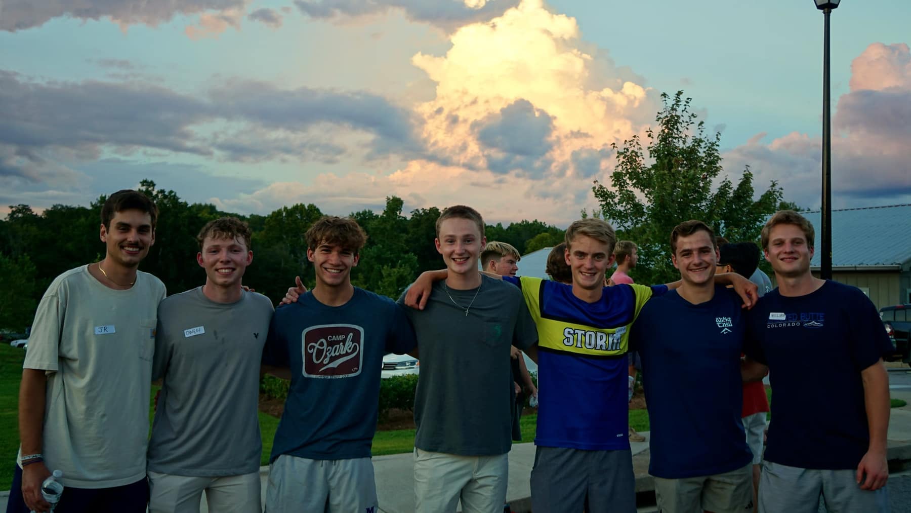 A group of new friends smiling together at Trivia Night